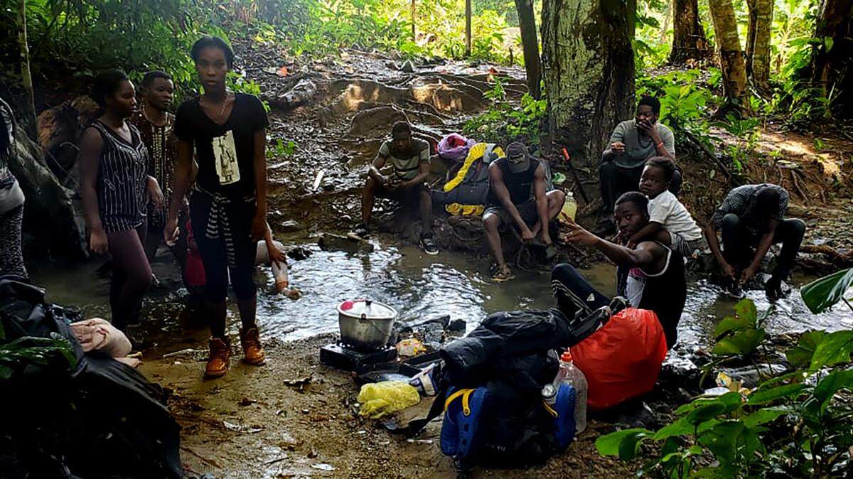 Migrants travel through the Darien Gap on the border between Panama and Colombia.