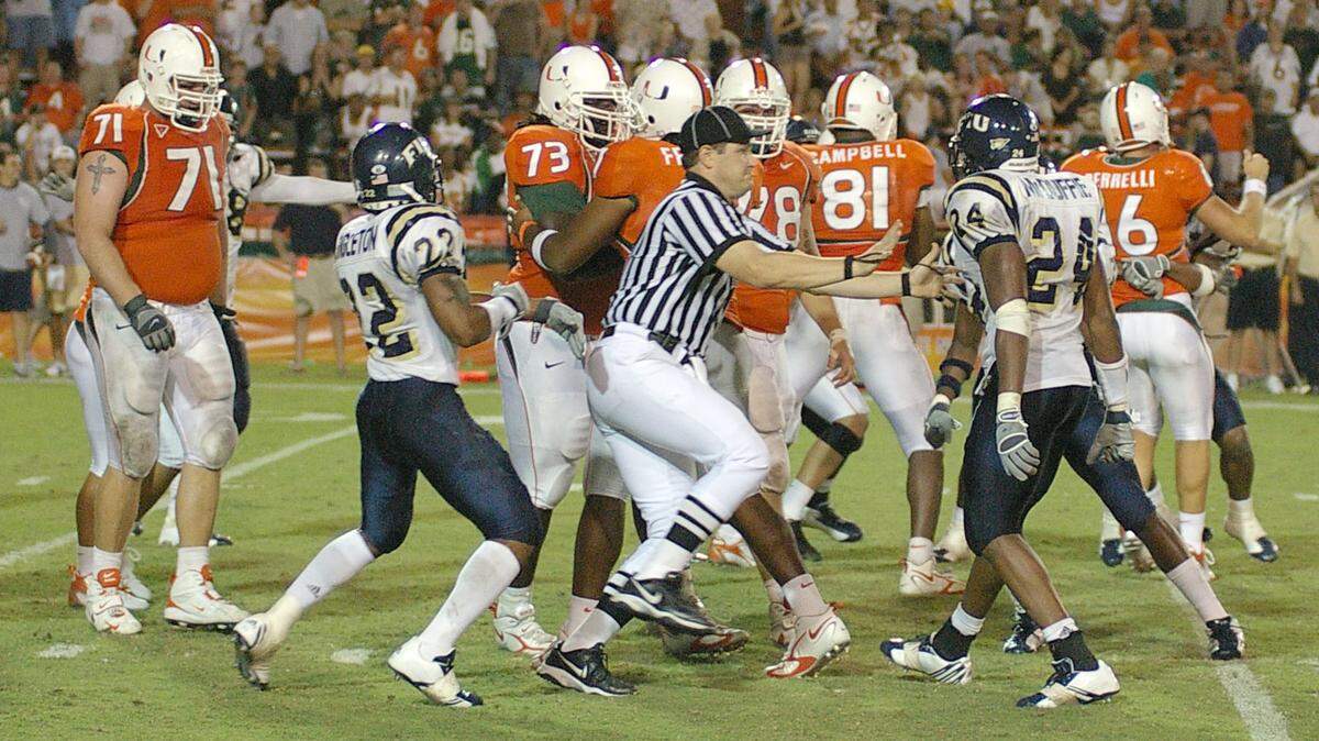 On Oct. 14, 2006, a game officials tries to stop the brawl before it starts during the FIU vs. UM game in the Orange Bowl.