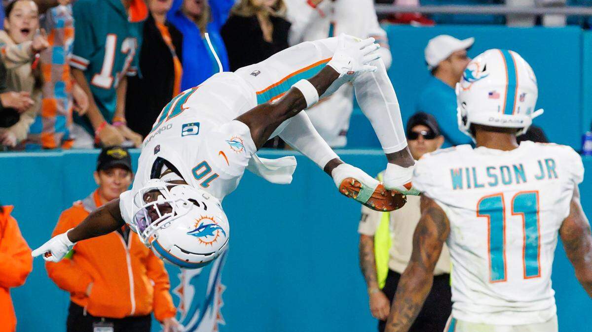 Miami Dolphins wide receiver Tyreek Hill (10) celebrates after scoring a touchdown during first half of an NFL football game against the Buffalo Bills at Hard Rock Stadium on Sunday, Jan. 7, 2024 in Miami Gardens, Fl.