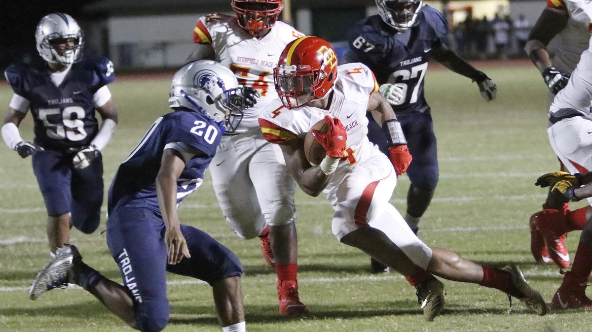 Deerfield Beach Bucks’ running back Jaylan Knighton (4) runs for a touchdown against Taravella Trojans during the football game on Thursday, September 27, 2018 at Coral Springs High in Coral Springs.