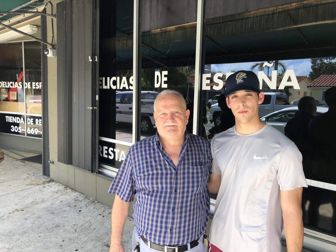 Ernesto Llerandi and his grandson Andres visited the original Delicias de España after a fire gutted it overnight Oct. 16. Llerandi founded the Spanish restaurant and market nearly 21 years ago, and his grandson has worked there the past three years.