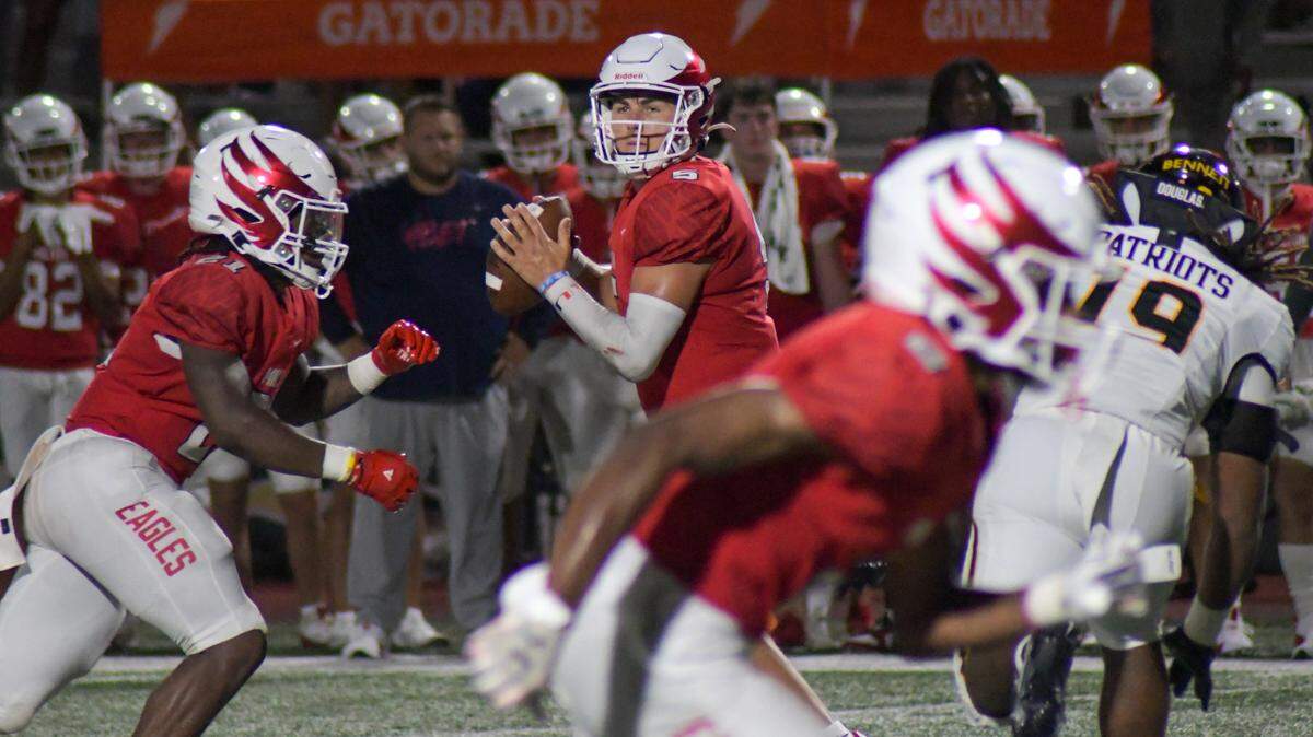 Milton quarterback Luke Nickel drops back to pass against American Heritage on Friday, Aug. 23, 2024, in a Broward County High School National Football Showcase game at St. Thomas Aquinas in Fort Lauderdale, Florida.