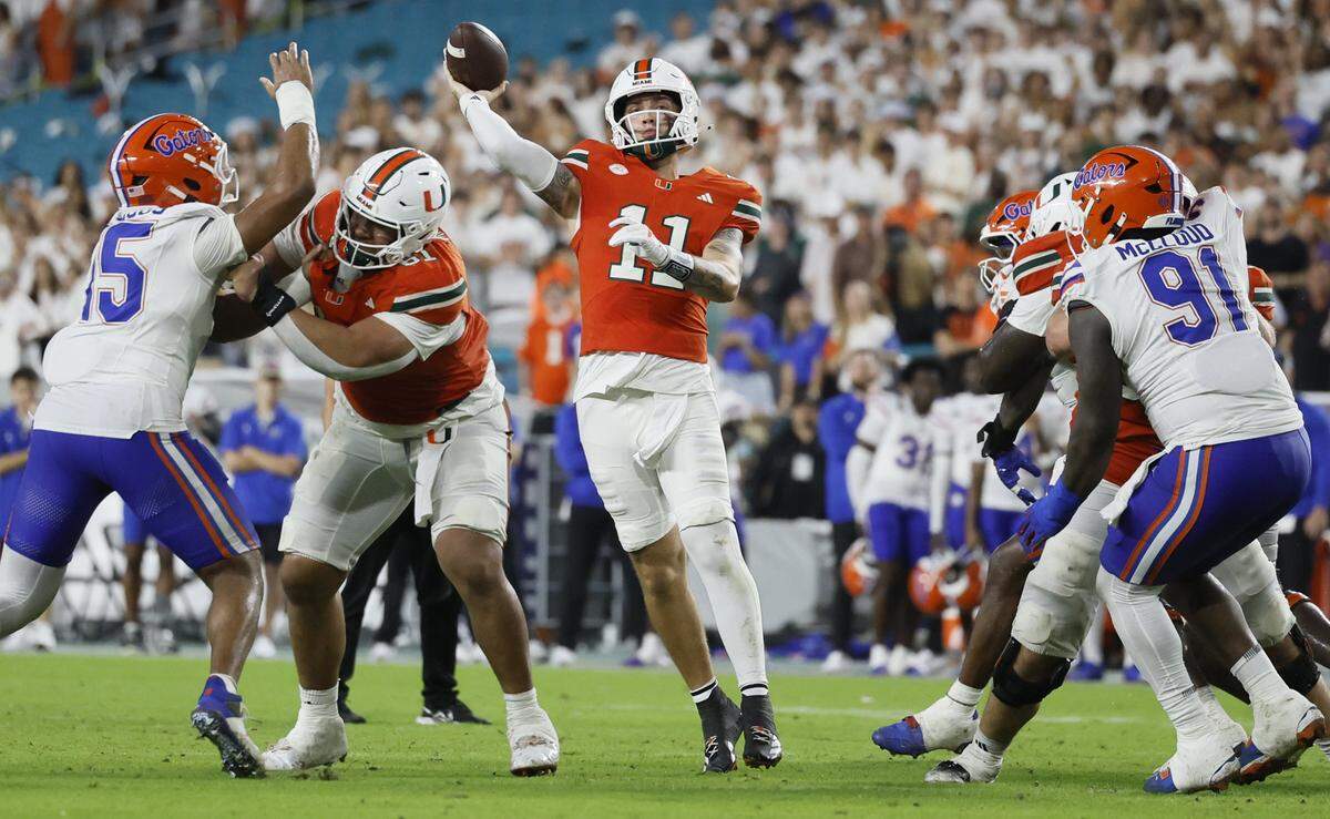 Miami Hurricanes quarterback Carson Beck throws a pass in the first half during their NCAA football game against the Florida Gators at Hard Rock Stadium in Miami Gardens, Florida.