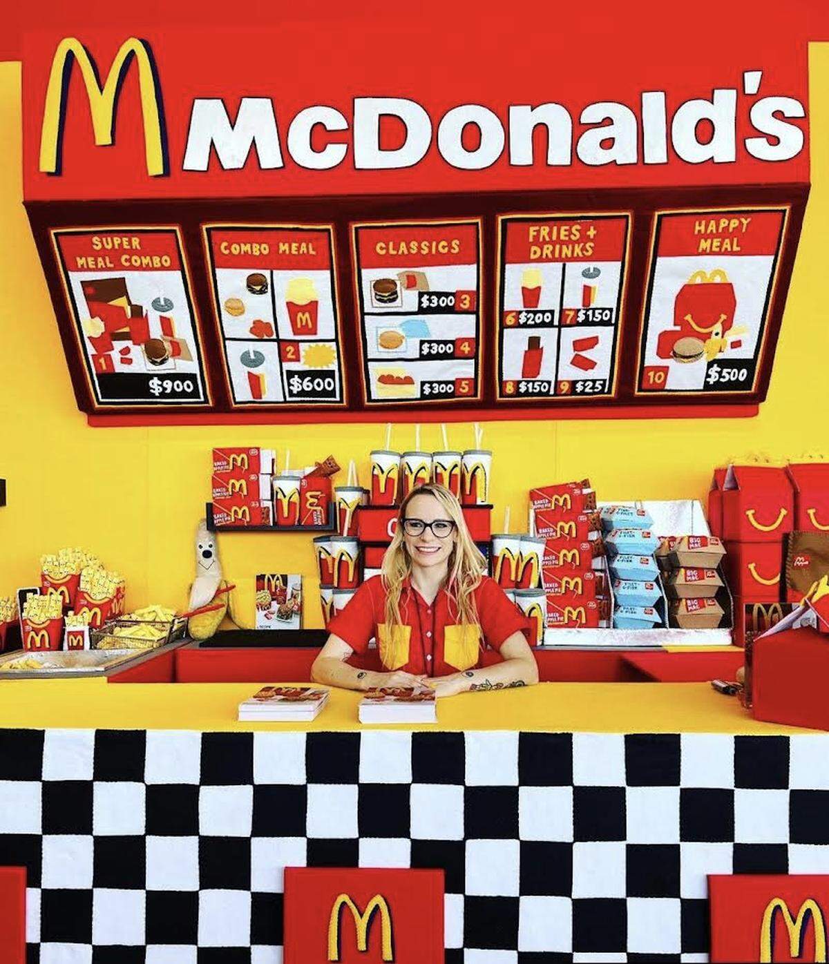 British artist Lucy Sparrow at her “MC-HAPPINESS” installation at SCOPE in Miami Beach. Sparrow made a McDonald’s entirely out of felt fabric.