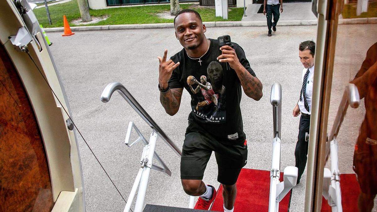 Miami Hurricanes receiver Mike Harley boards a plane headed for Charlotte, North Carolina, where Harley, quarterback D’Eriq King and safety Bubba Bolden were to meet the media on Wednesday, July 21, 2021.