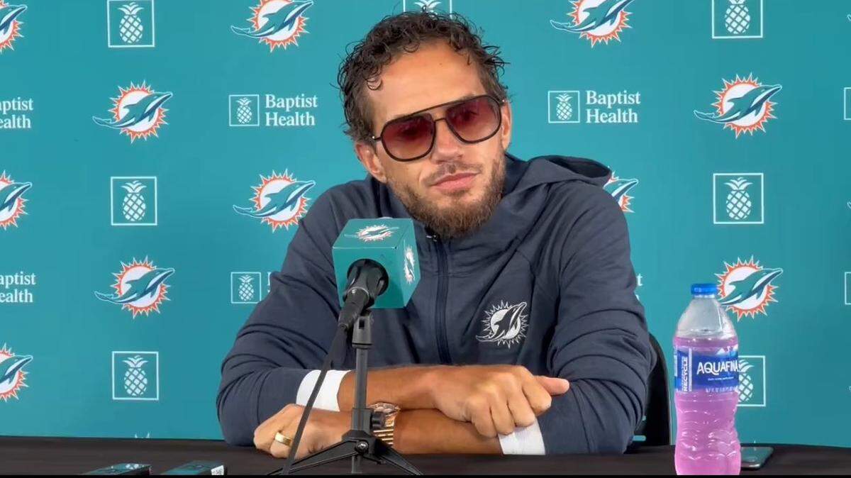 Miami Dolphins head coach Mike McDaniel at the podium on Wednesday, August 21, 2024 in Tampa, Florida. McDaniel’s appearance went viral after social media users began to compare the above picture of him with photos of him from 2021.