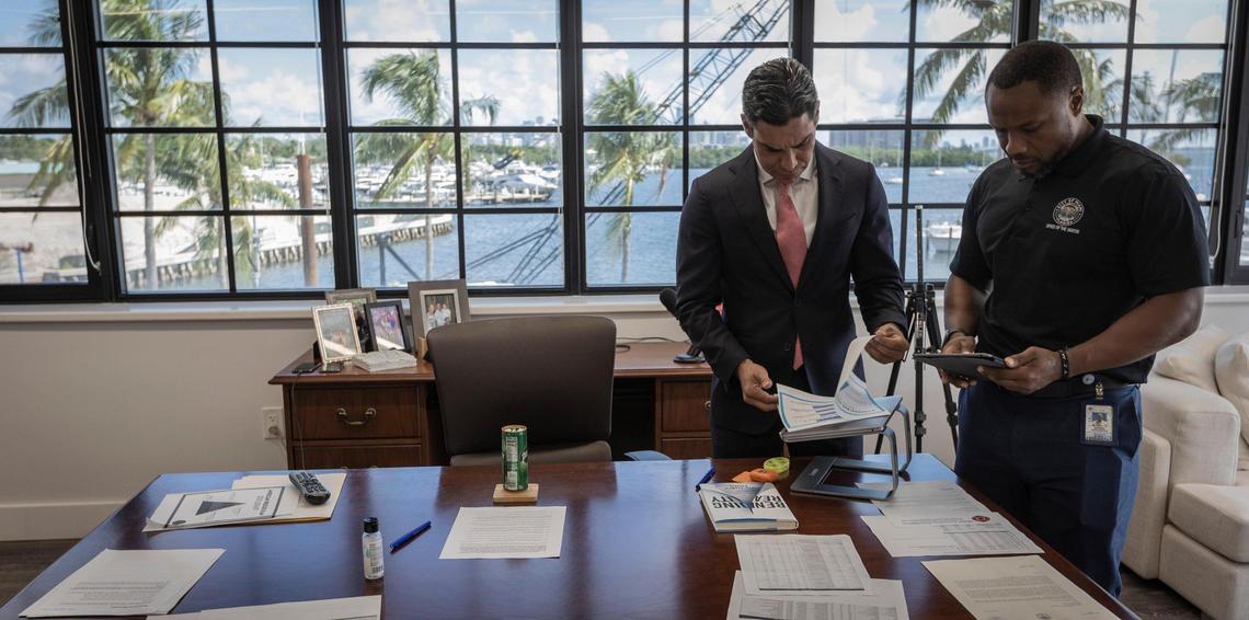 Miami Mayor Francis Suarez, left, reviews talking points on the city’s spending plan for federal pandemic relief funds with special aide Moises Hernandez on Sept. 14, 2021.