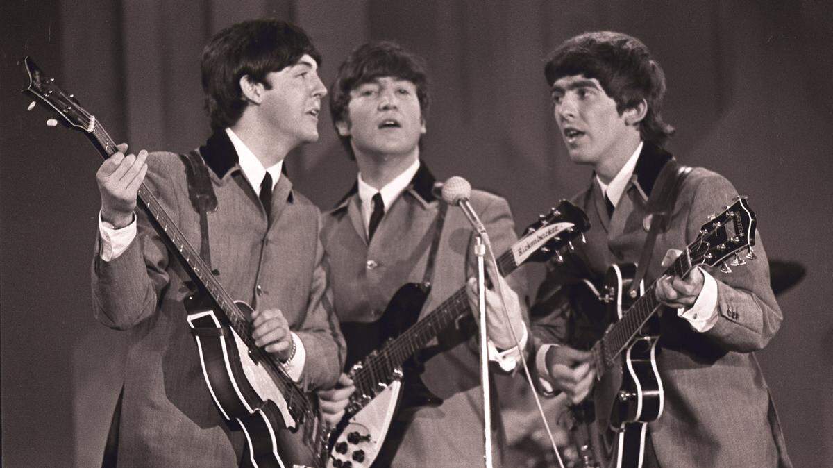 Paul McCartney, John Lennon and George Harrison — Ringo Starr was there, too! — perform on “The Ed Sullivan Show” from the Deauville hotel on Feb. 16, 1964.