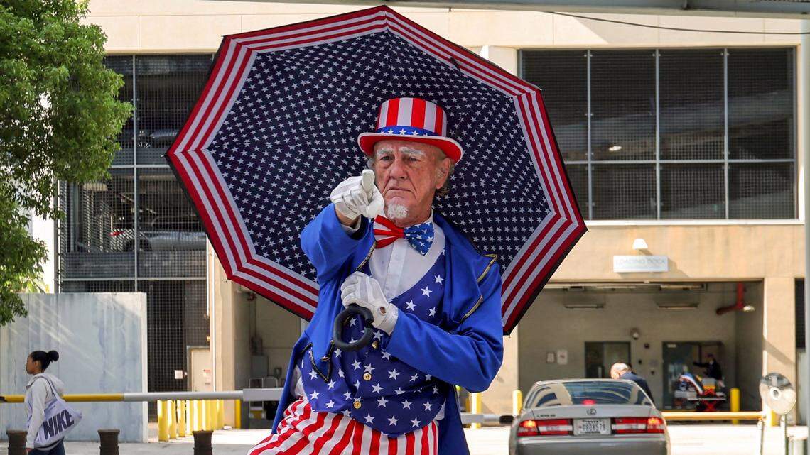 MAGA hats, convict stripes and a dead pig: Trump fans, foes show up at Miami courthouse