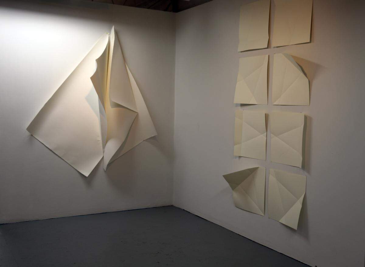 Rosemarie Charlione’s folded sculptures are part of a show of paper works on display at Bridge Red Studios through March 10, 2019.
