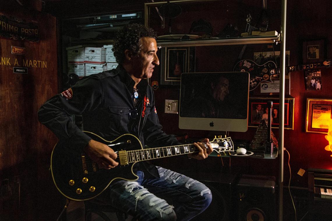 Owner Gerardo Cea plays guitar in his studio in the back of Cafe Prima Pasta.