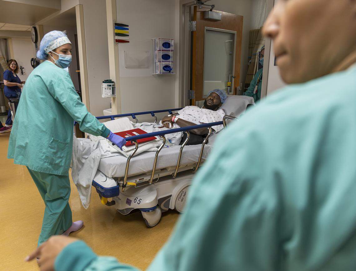 Chevon Byfield, 39, who suffers from heart failure and relies on a left ventricular assist device (LVAD), is taken to an operating room for a procedure at Memorial Regional Hospital on Tuesday, Feb. 3, 2026, in Hollywood, Fla. After waiting more than six years for a transplant, Byfield checked into the hospital for the fourth time Tuesday to remain on-site indefinitely until a compatible heart becomes available.