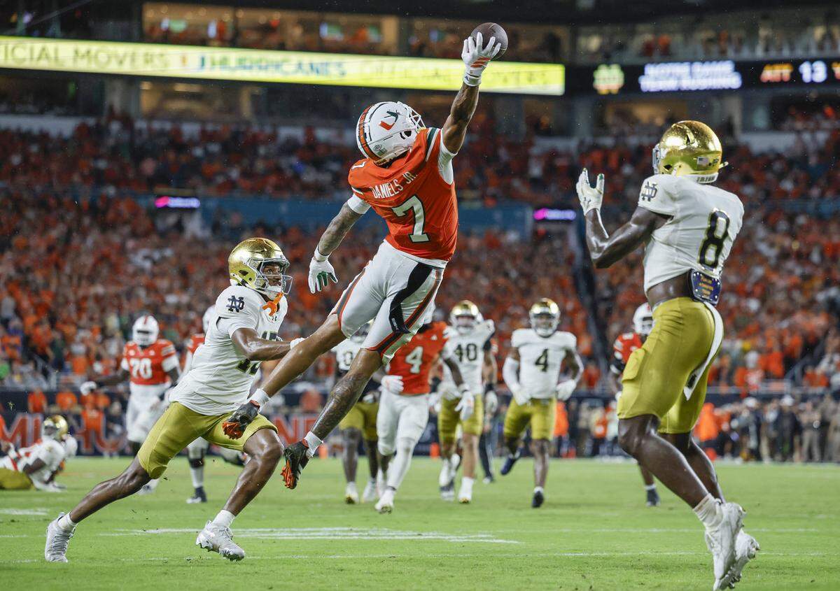 Miami Hurricanes wide receiver CJ Daniels (7) on a one handed catch for the touchdown in the second quarter against the Notre Dame Fighting Irish during an NCAA football game at Hard Rock Stadium in Miami Gardens, Florida, on Sunday, August 31, 2025. 