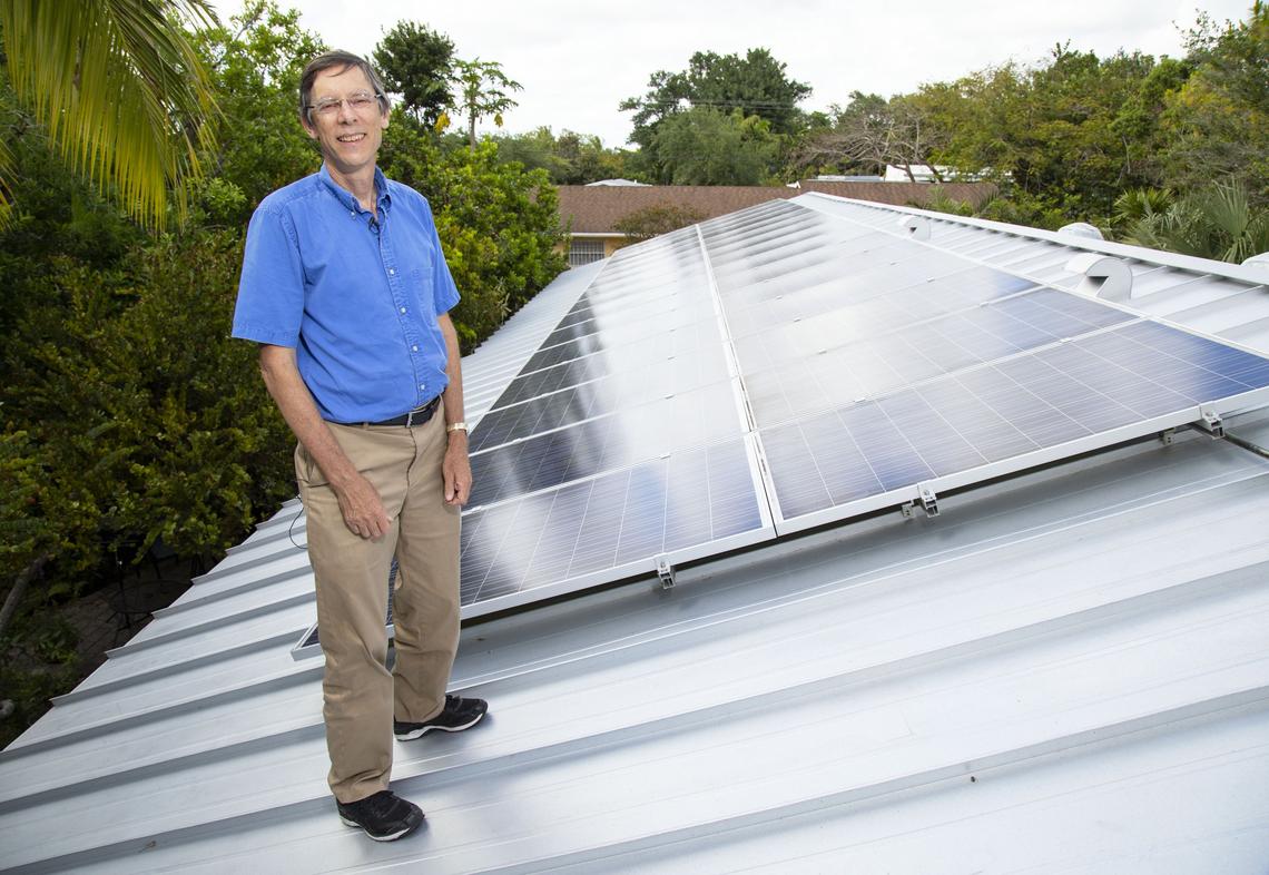 South Miami Mayor Philip Stoddard on the roof of his home in April 2019. Stoddard went off the grid for seven days to test the house’s readiness for hurricane season, using only solar panels and two Tesla wall batteries to power his home.