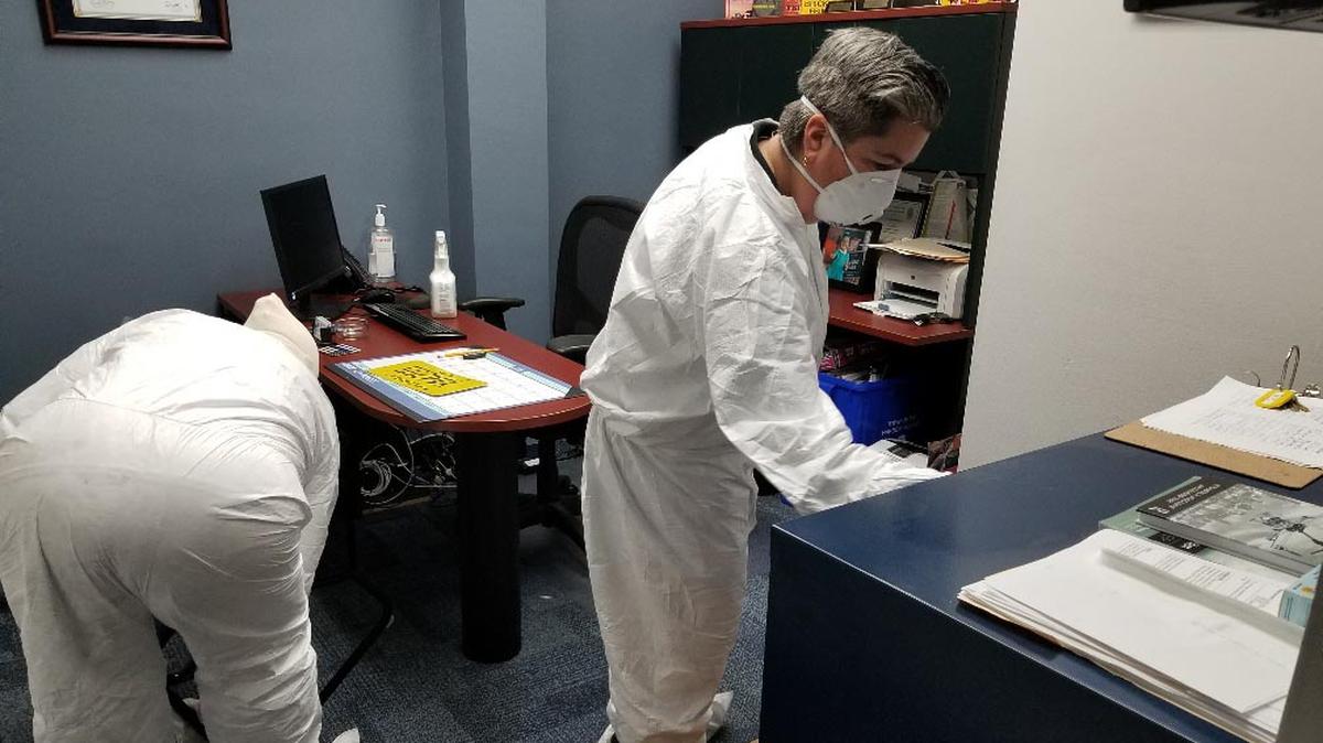 A crew from SFM Services scrubs offices at the town of Bay Harbor Islands on Sat., March 14, 2020, after concerns about coronavirus exposure there. Miami-Dade is closing a permitting office for two days for a deep cleaning after a worker in the facility tested positive for COVID-19.