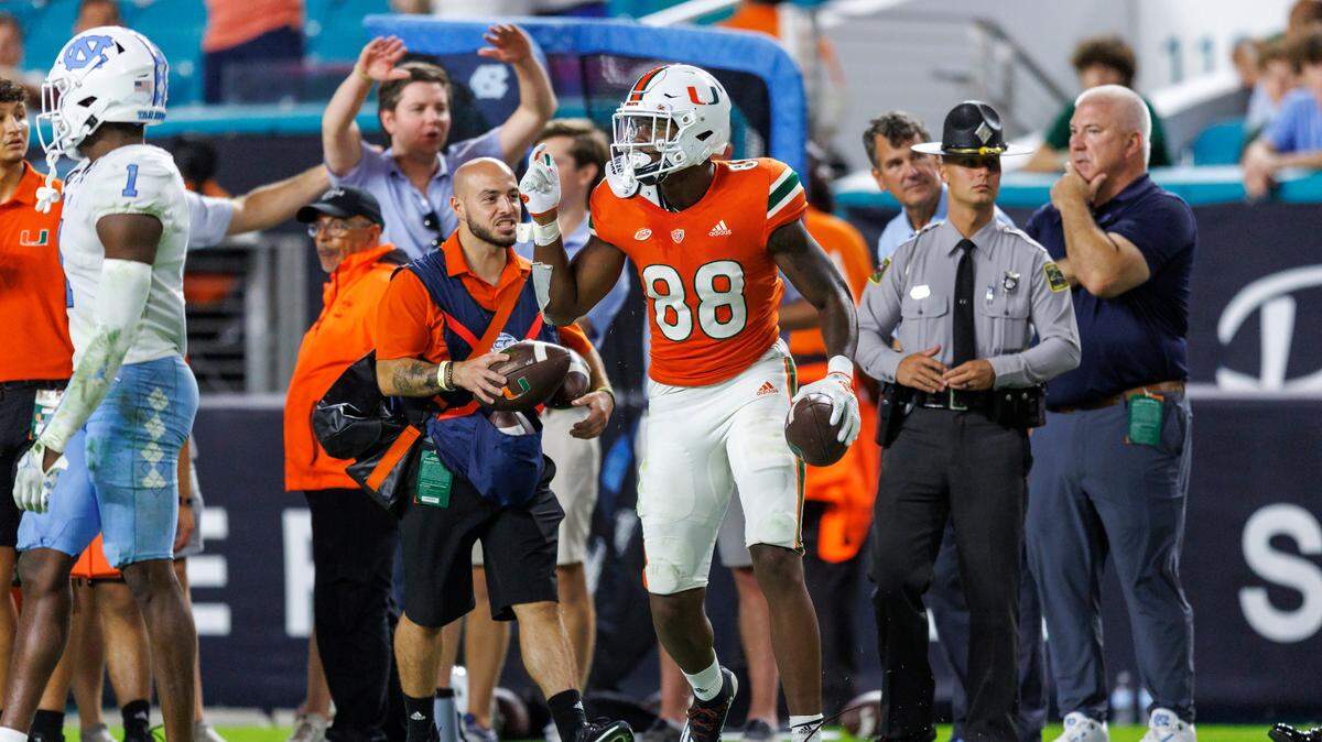 Miami Hurricanes wide receiver Colbie Young (88) reacts after making a catch during the fourth quarter of an ACC conference football game against North Carolina Tar Heels at Hard Rock Stadium on Saturday, October 8, 2022 in Miami Gardens, Florida..