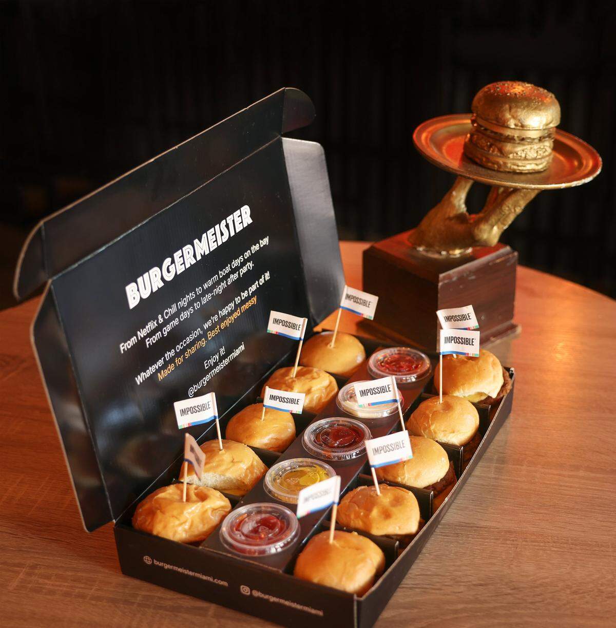 Alexander Ringleb and Fernanda Ringleb, owners of Burgermeister in Miami's Brickell neighborhood, display a ten-pack of “Impossible” burgers at their restaurant on Thursday, May 8, 2028.