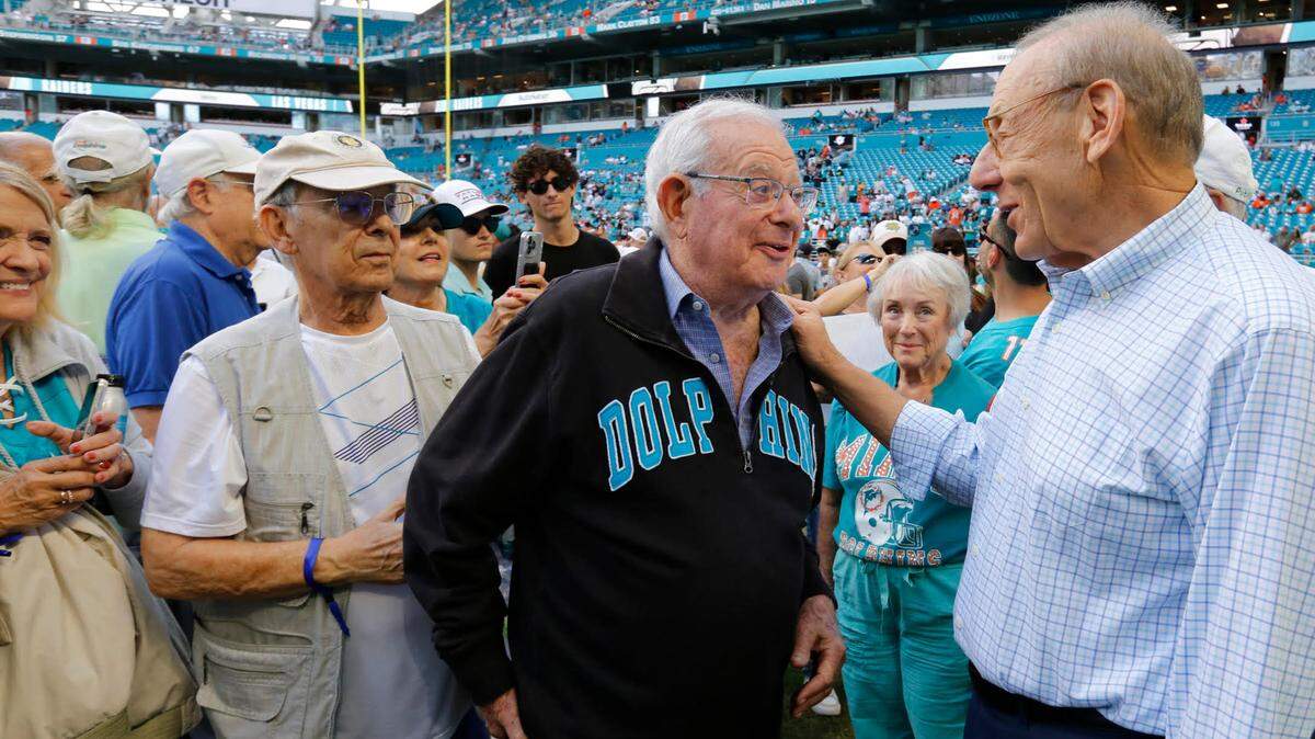 Miami Dolphins owner Stephen Ross speaks with classmates Stanley Schwartz, at center, and Floyd Stern at left, during a reunion before the start of the game between the Miami Dolphins and the Las Vegas Raiders at Hard Rock Stadium in Miami Gardens on Sunday, November 19, 2023.