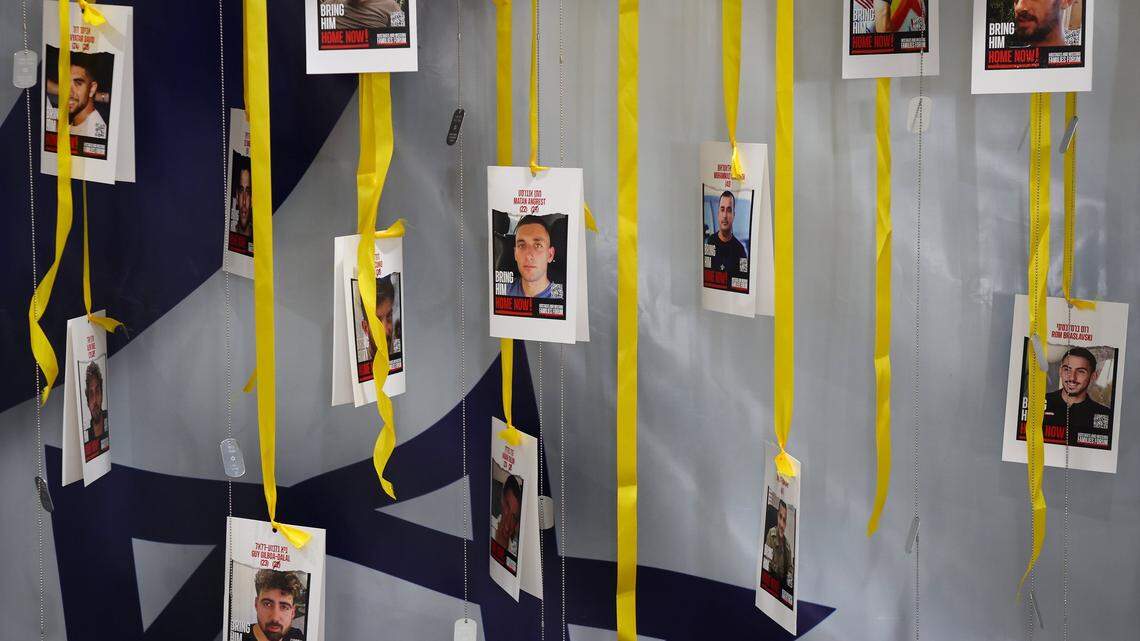 South Florida Jews celebrated the release of the 20 living hostages after Israel and Hamas reached a ceasefire deal. In this photo, images of hostages are hung by yellow ribbons alongside dog tags at a Broward commemorative event held earlier this month. 