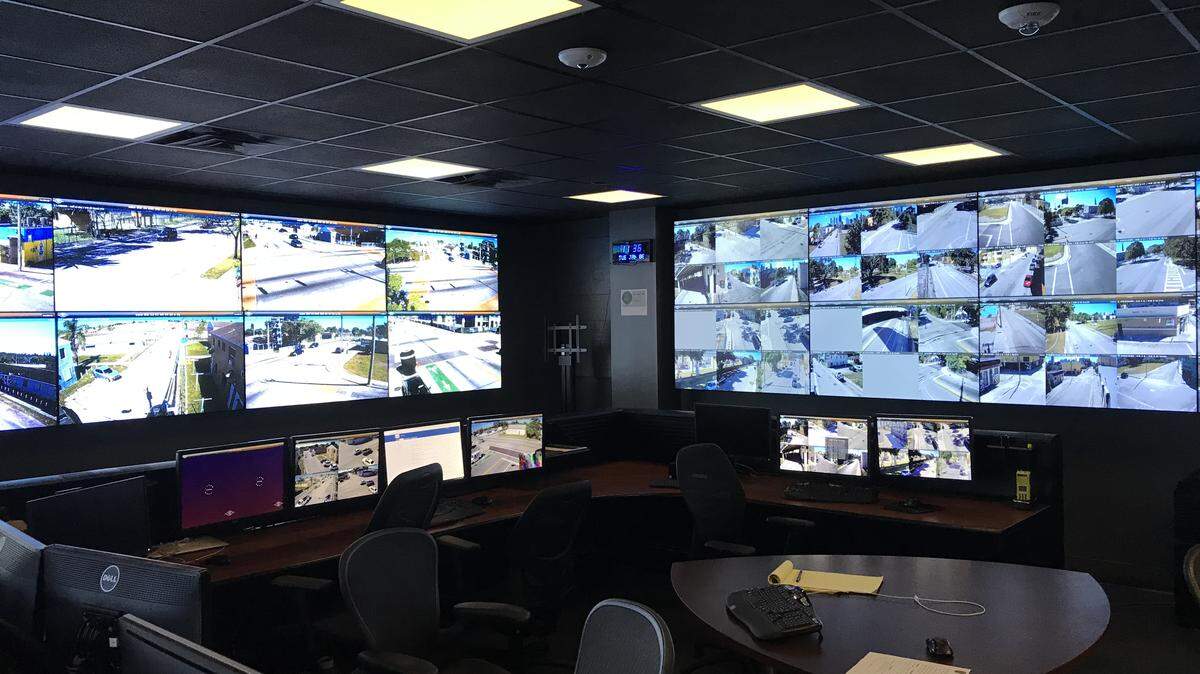 A command center at Miami police headquarters now has more than 160 cameras throughout the city that officers can monitor to stop and solve crimes.