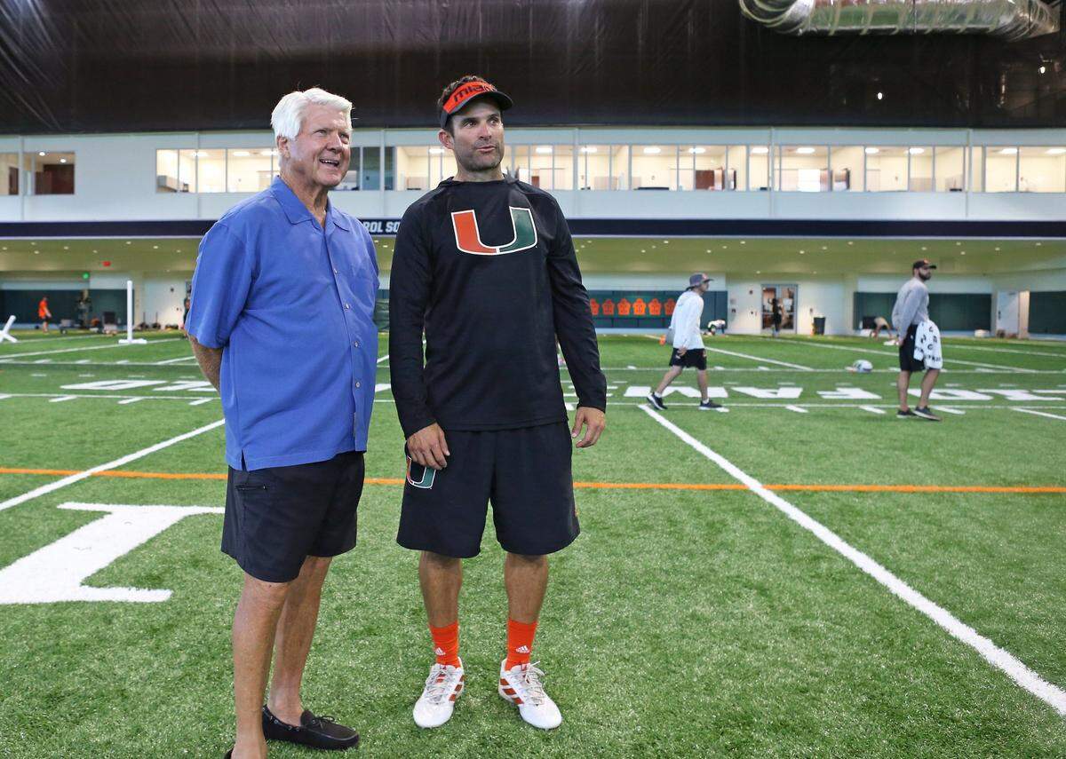 Former Miami Hurricanes coach Jimmy Johnson talks with with Hurricanes head coach Manny Diaz after practice at the University of Miami Greentree Practice Field in Coral Gables on Wednesday, August 21, 2019.