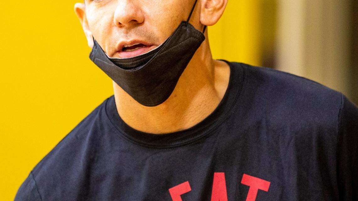 Miami Heat Assistant Coach Chris Quinn speaks with a staff member during practice at FTX Arena in Miami, Florida, on Thursday, September 30, 2021.