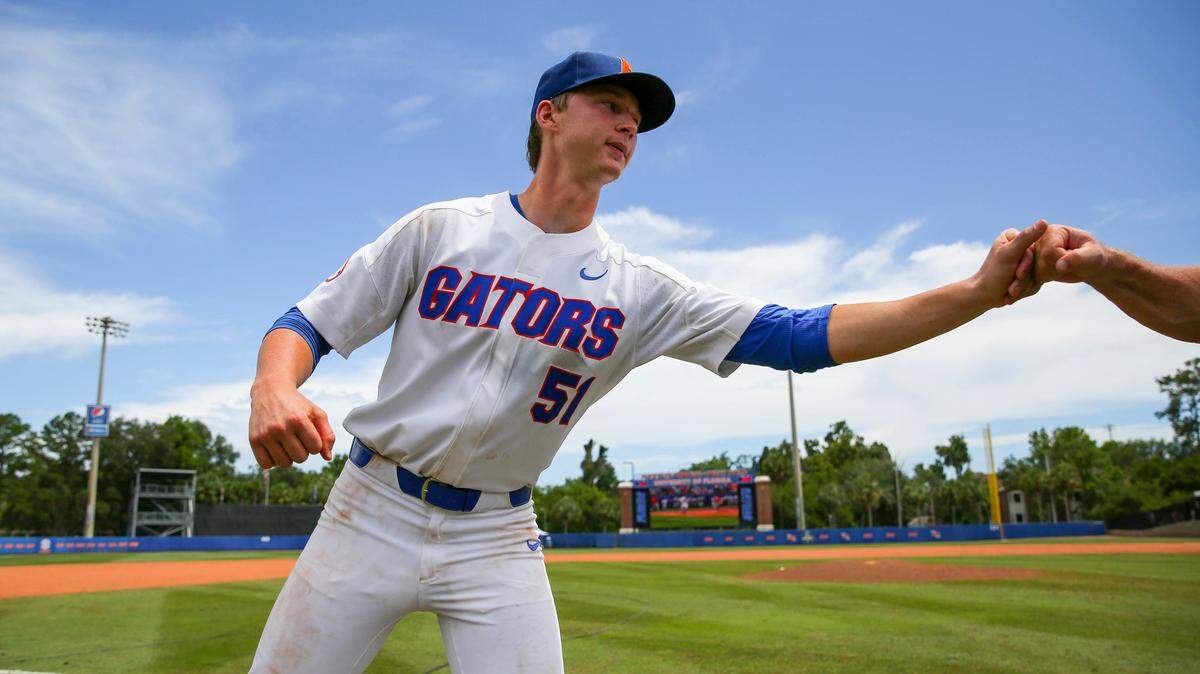 Florida pitcher Brady Singer celebrates after an NCAA Super Regional college baseball game against Auburn, Saturday, June 9, 2018, in Gainesville, Fla. Florida defeated Auburn 8-2.