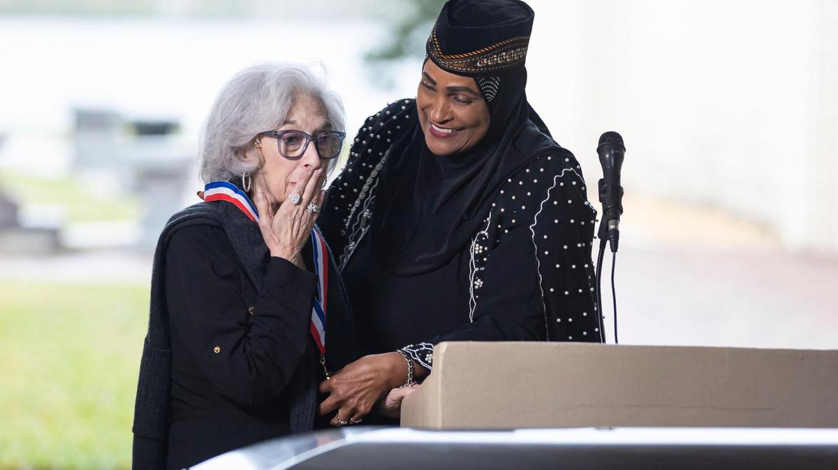 Joyce Moore, widow of the late Sam Moore, reacts after Khalilah Ali, former wife of Muhammad Ali, presented her with the President’s Lifetime Achievement Award during his funeral service at Lakeside Memorial Park and Funeral Home on Friday, Jan. 17, 2025, in Doral, Fla. Moore, the R&B singer from the famed 1960s duo Sam & Dave, died on Friday, Jan. 10, at the age of 89.