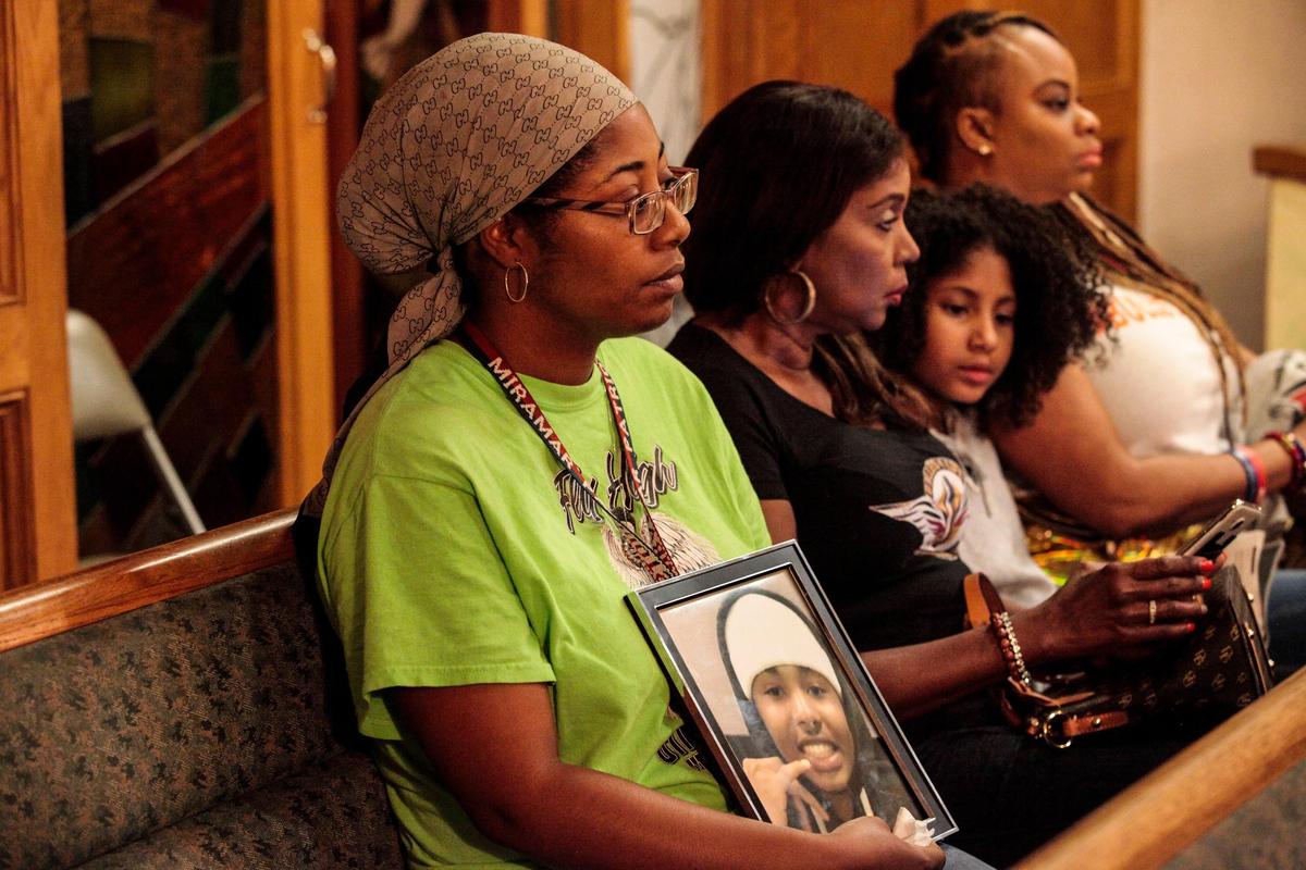Omorose Butler holds a picture of her son Mendell Butler-Lebel, who was an innocent bystander in a drive-by shooting on July 2, 2018. Butler-Lebel was 17 when he died.