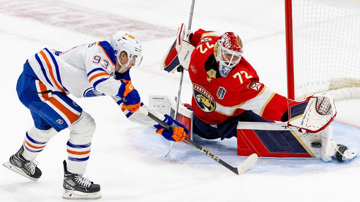 Florida Panthers goaltender Sergei Bobrovsky (72) blocks a shot from Edmonton Oilers center Ryan Nugent-Hopkins (93) during the first period of Game 1 of the NHL Stanley Cup Final at the Amerant Bank Arena on Saturday, June 8, 2024, in Sunrise, Fla.