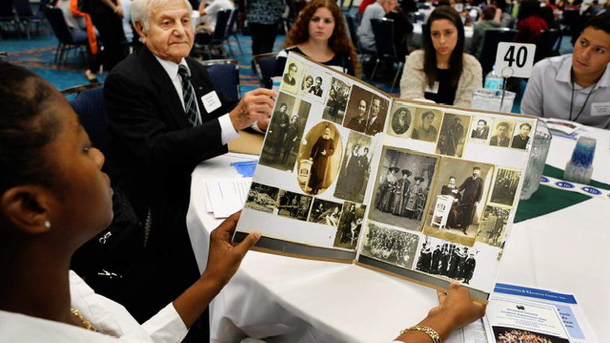 Teens join Holocaust survivor Morris Dan, now 96, at the Dania Beach Holocaust Documentation & Education Center’s Broward County Student Awareness Day in 2018. Awareness days were virtual during the pandemic.