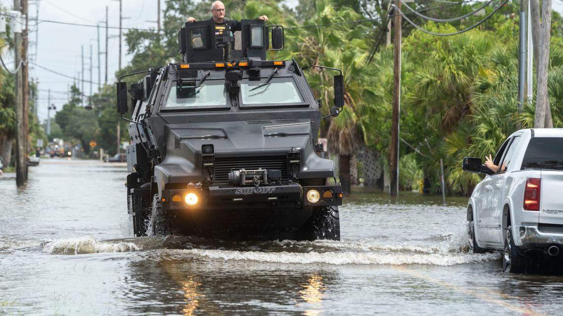 Pasco County Sherriff’s officer drives through a flooded street after Hurricane Idalia in Hudson, Fla. on Aug. 30, 2023,