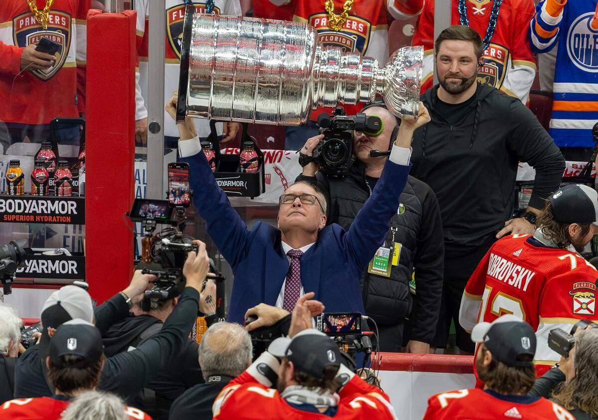 Florida Panthers head coach Paul Maurice lifts the Stanley Cup after the Panthers defeated the Edmonton Oilers in Game 7 of the NHL Stanley Cup Final at the Amerant Bank Arena on Monday, June 24, 2024, in Sunrise, Fla.