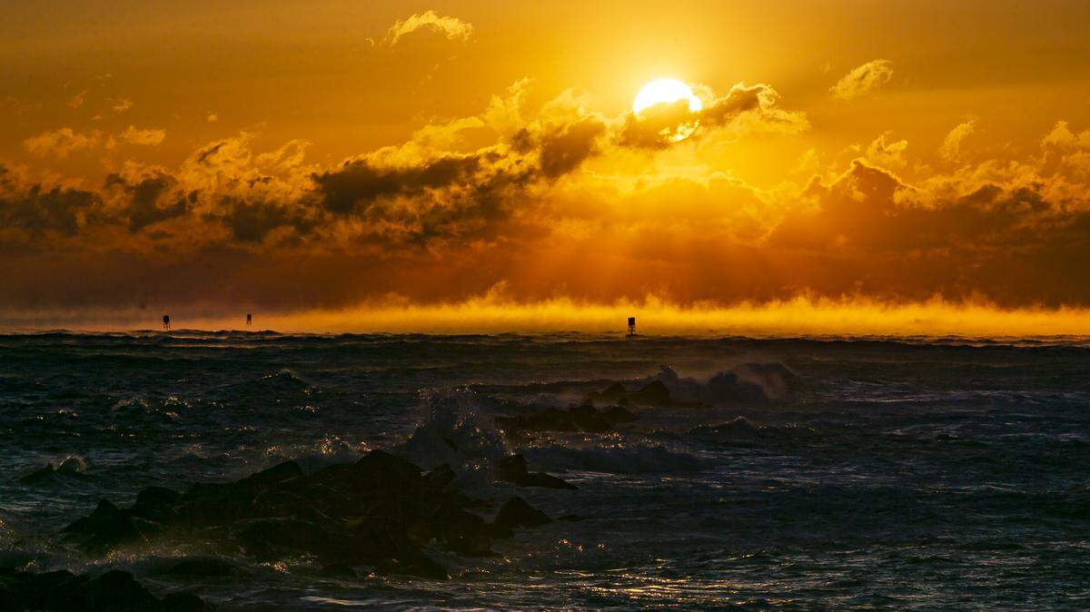 A view of the sunrise near South Pointe Park Pier in Miami Beach as temperatures dip into the low 40s and upper 30s on Wednesday, January 22, 2020.