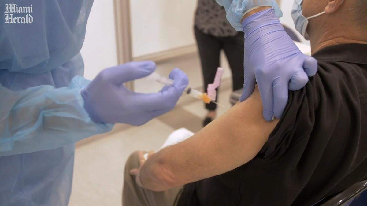 Many people in Greater Miami remain reluctant to get the COVID vaccine.