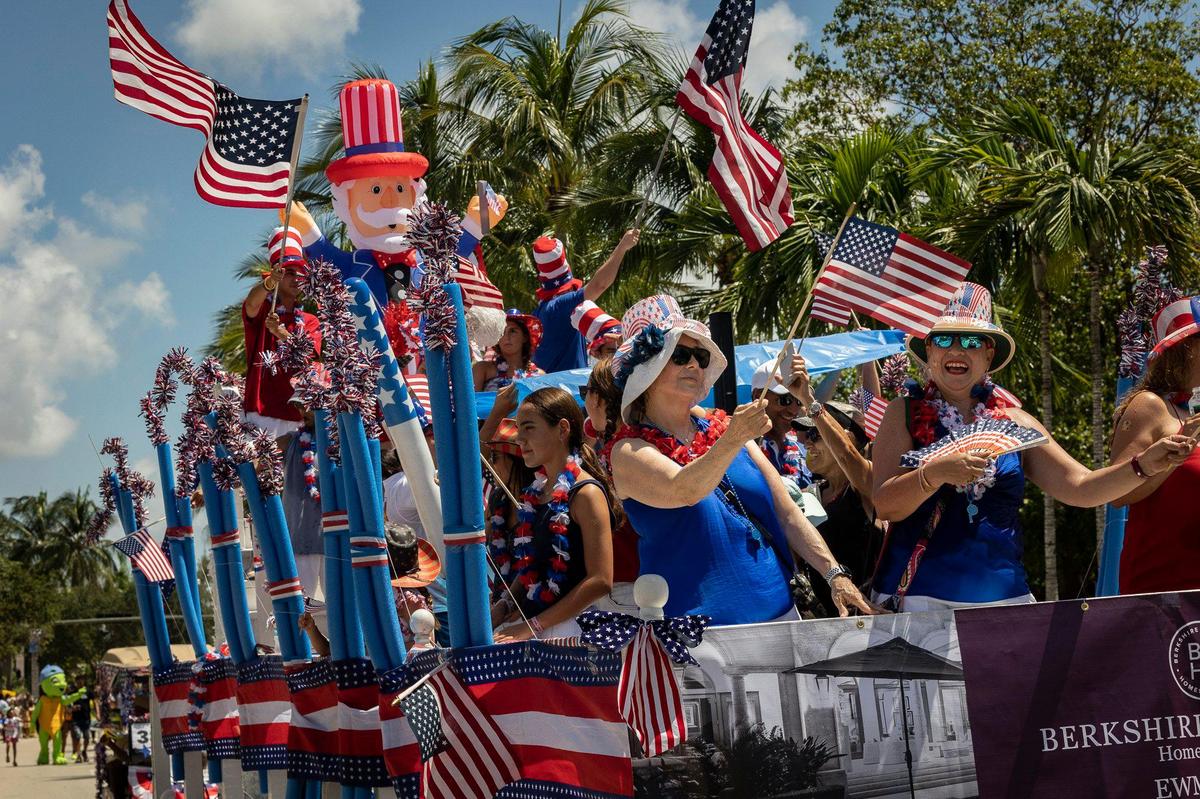 Happy birthday, America. Celebrants on a patriotic float during the Fourth of July parade along Crandon Boulevard in Key Biscayne.