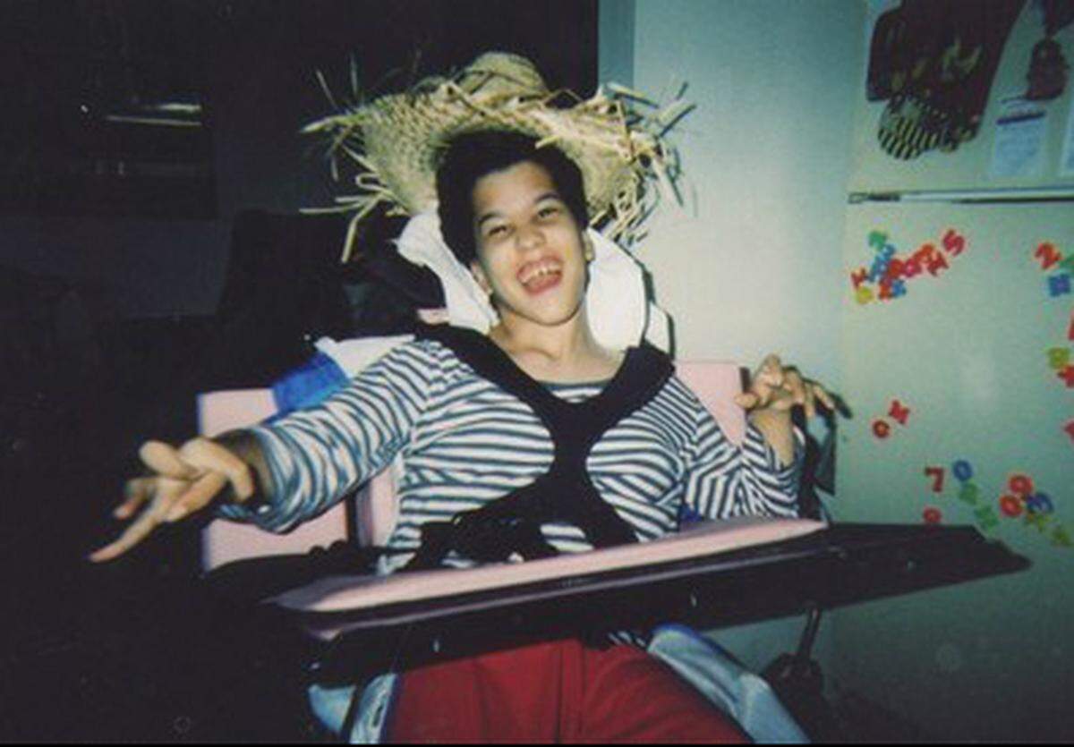 Marie Freyre at home, in her wheelchair.