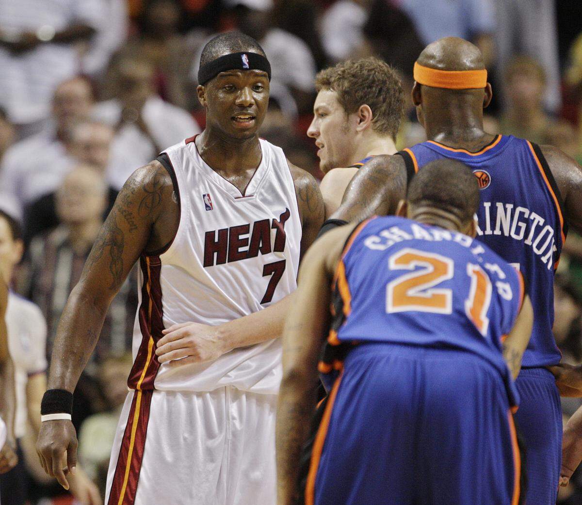 Heat center Jermaine O’Neal (7) exchanges words with Knicks forward Wilson Chandler (21) as the Knicks Al Harrington (7) tries to calm him down in the fourth quarter during Miami Heat vs New York Knicks on Feb. 28, 2009, at AmericanAirlines Arena..