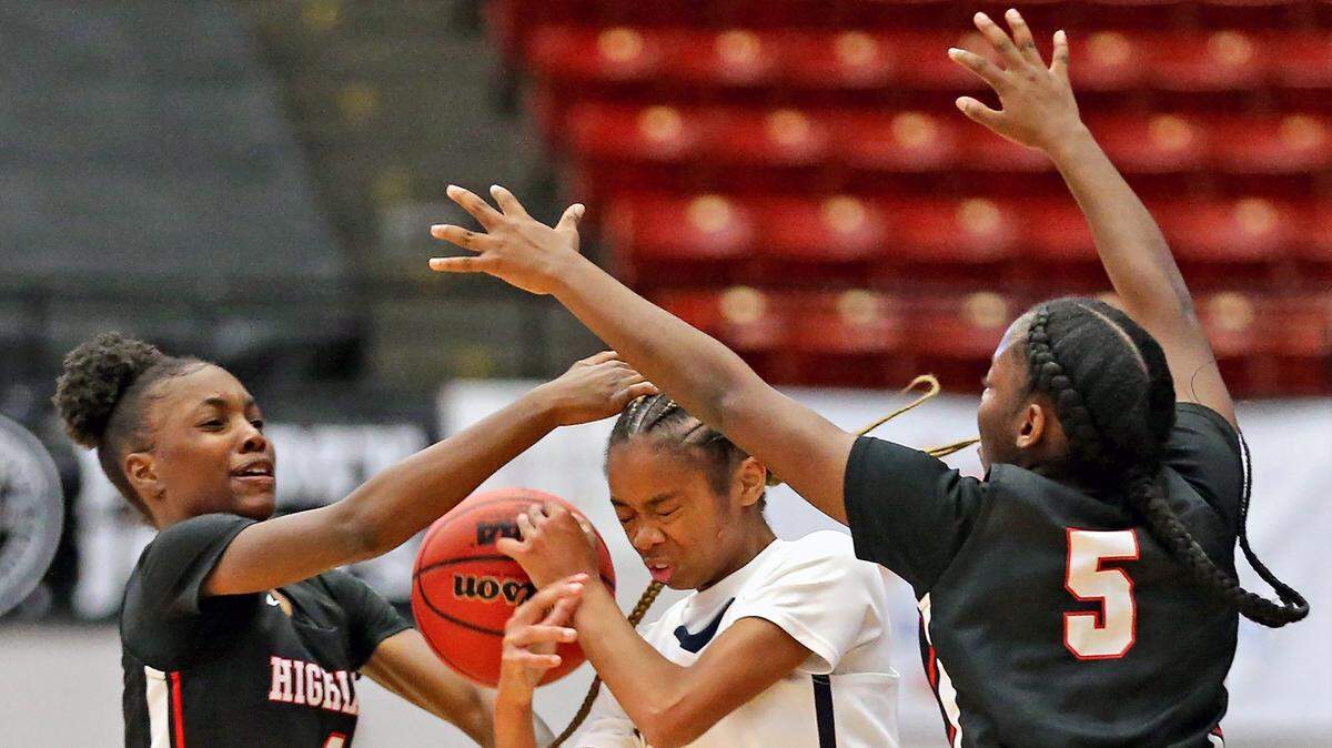 Keys Gate HS Amari Hunter (2) gets the ball knocked away by Lake Highland Prep Eleecia Carter (1) and Sierra Godbolt (5) in the 5A Semi-Finals Girl’s State Basketball Championships at the RP Funding Center in Lakeland, Florida, Wednesday, February, 27, 2019.
