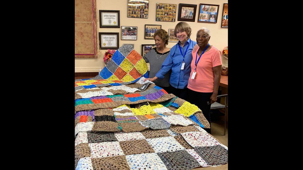 Sharing their time-consuming crocheted ‘plarn’ mat creations at the Senior LIFT Center are Mavis (Dols) Williams, Lindy Leftwich, and Sarah Francis. Contributing crafter not pictured is Estella Galarza. The mats will be donated to the homeless.