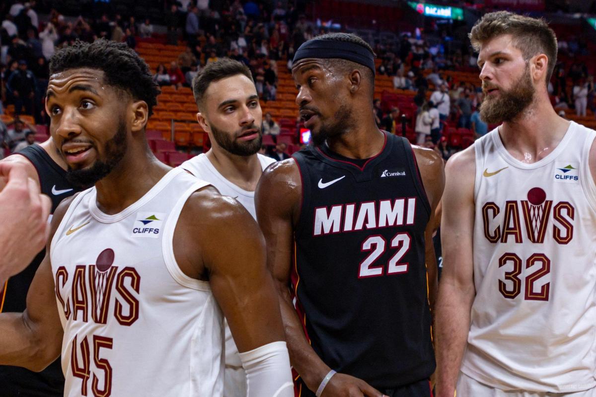 Miami Heat forward Jimmy Butler (22) speaks with Cleveland Cavaliers shooting guard Max Strus (1) after an NBA game at Kaseya Center in Miami, Florida, on Friday, December 8, 2023. The Heat lost 111-99 to the Cavaliers.