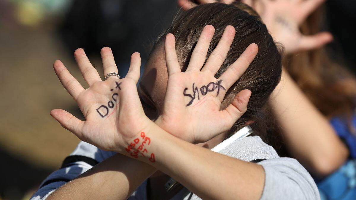 A student takes part in a protest against gun violence at Marjory Stoneman Douglas High School in Parkland, where 17 people were killed in February.