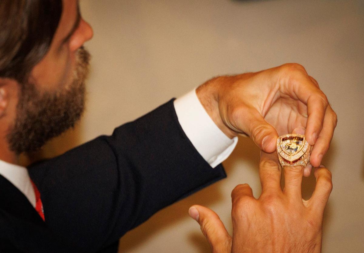 Aaron Ekblad puts on his ring during the Florida Panthers 2024 Champions Ring Ceremony on Monday, Oct. 7, 2024, at FTL War Memorial Auditorium in Fort Lauderdale, Fla.