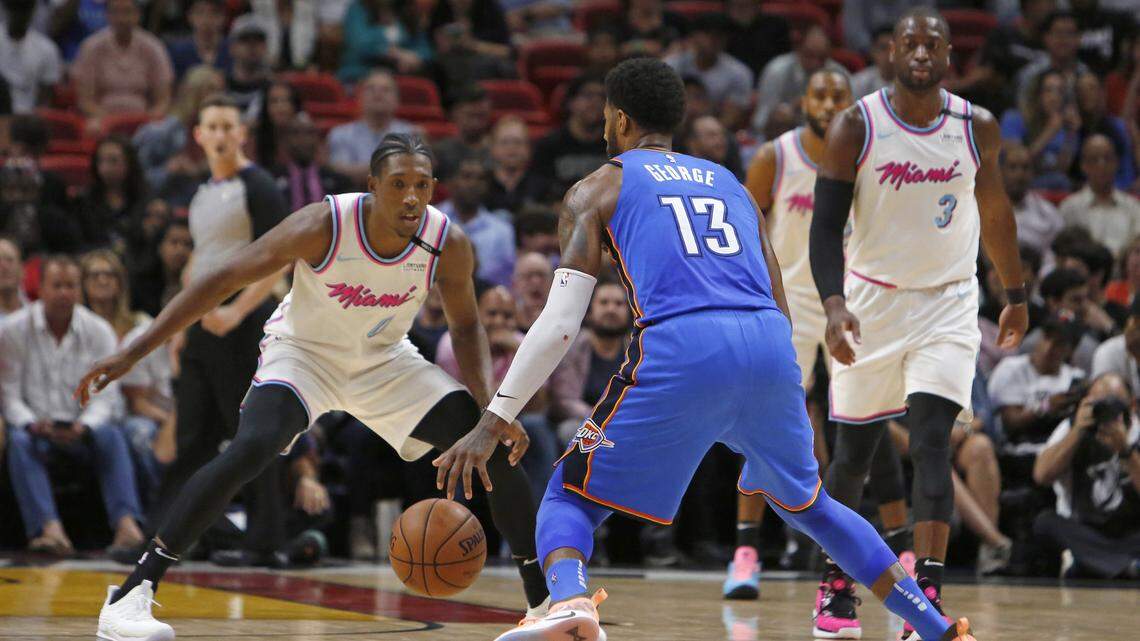 Oklahoma City Thunder forward Paul George drives against  Miami Heat guard Josh Richardson during the second quarter of an NBA basketball game at the AmericanAirlines Arena in Miami on Monday, April 9, 2018.
