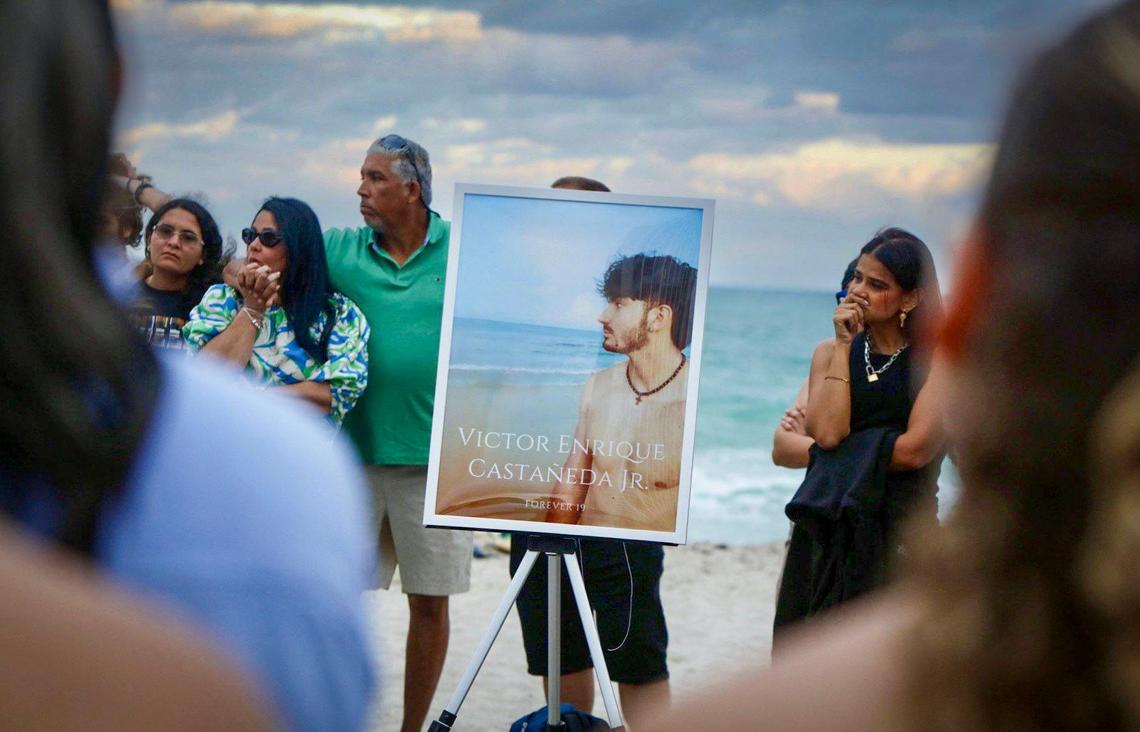 A picture of Victor Castaneda stands among family and friends who gathered in South Pointe Beach on Saturday, Nov. 16 for a memorial service for 19 -year-old Victor Castañeda who perished while swimming nearby.