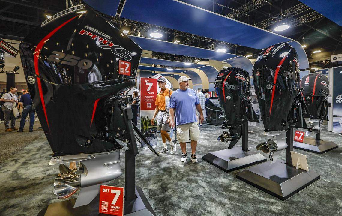 Mile Cole, from Virginia, views the Mercury outboard engines on display at the Miami Beach International Boat Show in the Miami Beach Convention Center on Miami Beach, Florida on Thursday, February 12, 2026.