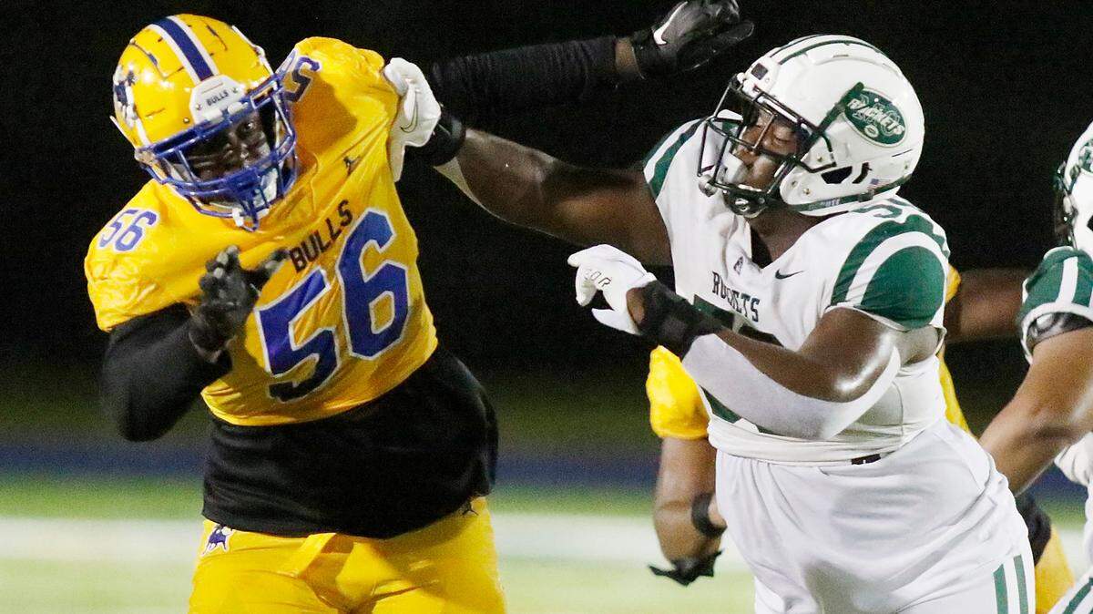 Miami Central Rockets offensive lineman Laurence Seymore (#50, on the right) plays against Northwestern Bulls during the Miami high school football season opener Friday, October 23, 2020 at Traz Powell stadium in Miami