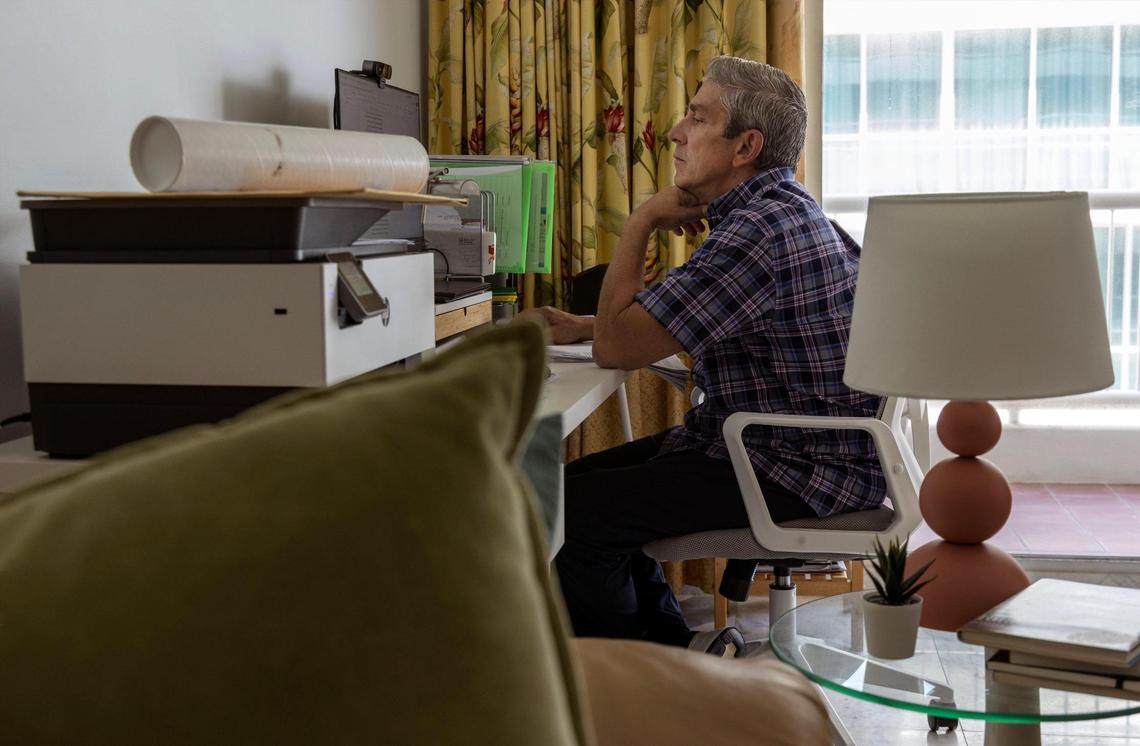 Richard Blanco, Miami-Dade’s new poet laureate, at his desk. He’ll act as a liaison between the arts and the community, he said.