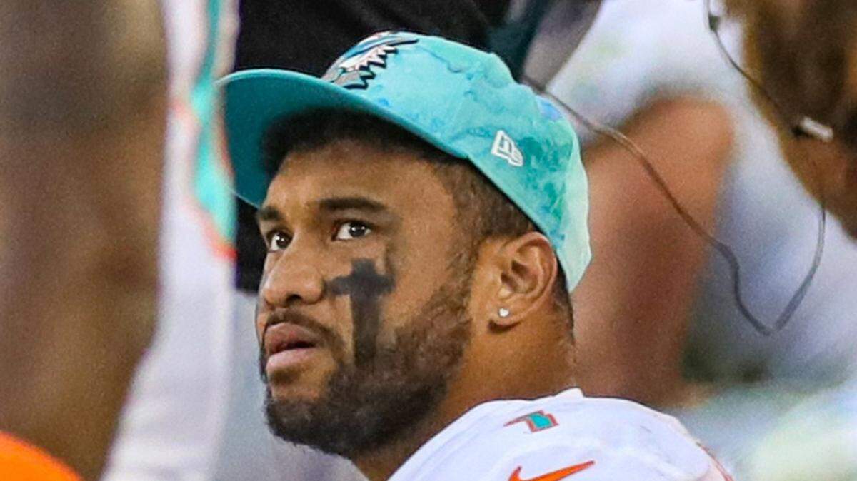 Miami Dolphins quarterback Tua Tagovailoa (1) looks up towards the big screen monitor in the final seconds of the game as the Dolphins go on to lose against the San Francisco 49ers at Levi’s Stadium in Santa Clara, California on Sunday, December 4, 2022.