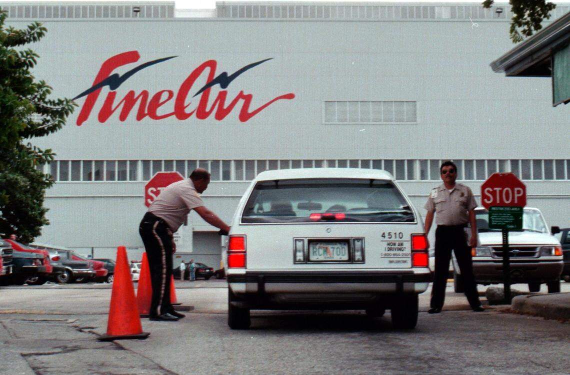 Security guards check vehicles at Fine Air’s airport and office at 4600 NW 36th St.
